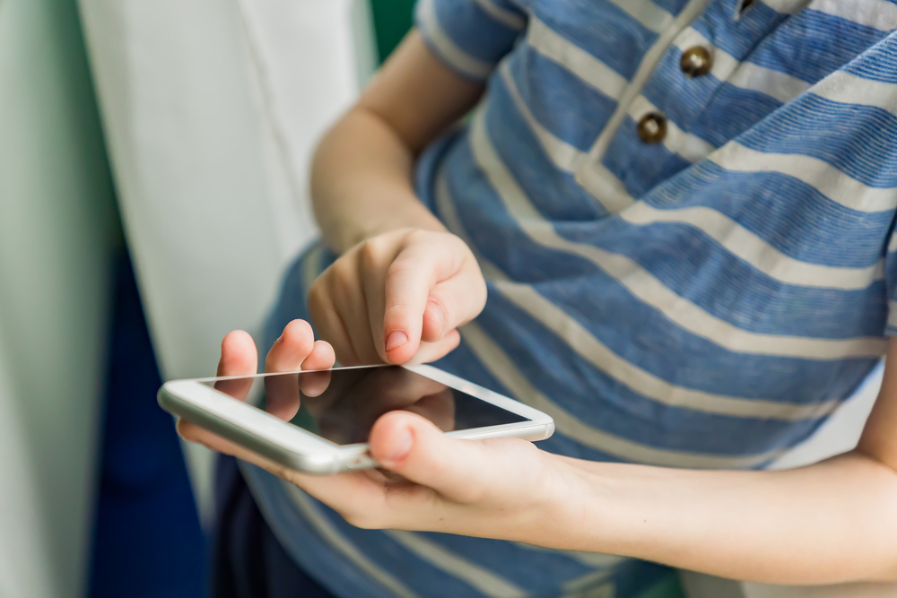 A closeup of a person using their phone.