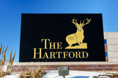A sign displaying The Hartford Insurance logo.