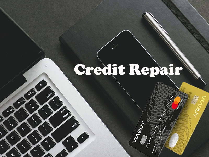 iphone and credit cards near laptop