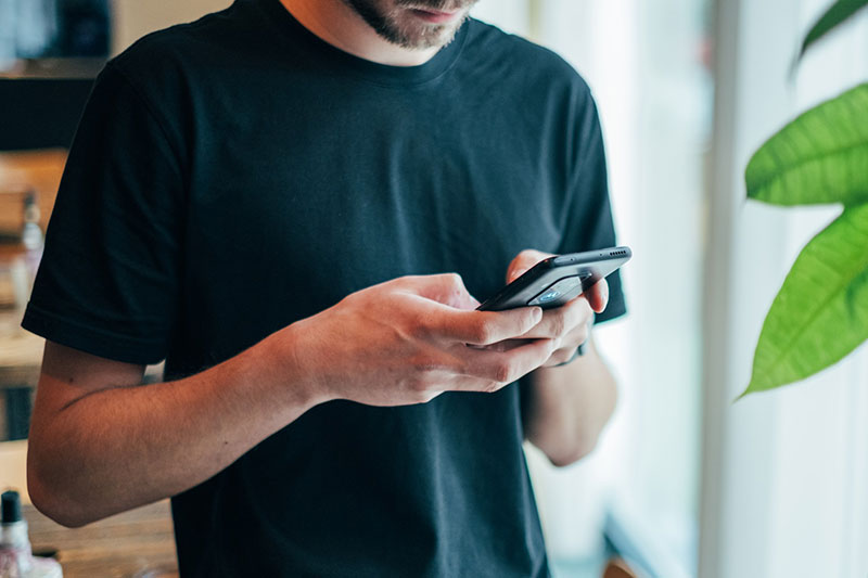 Man holding the smart phone in his hands