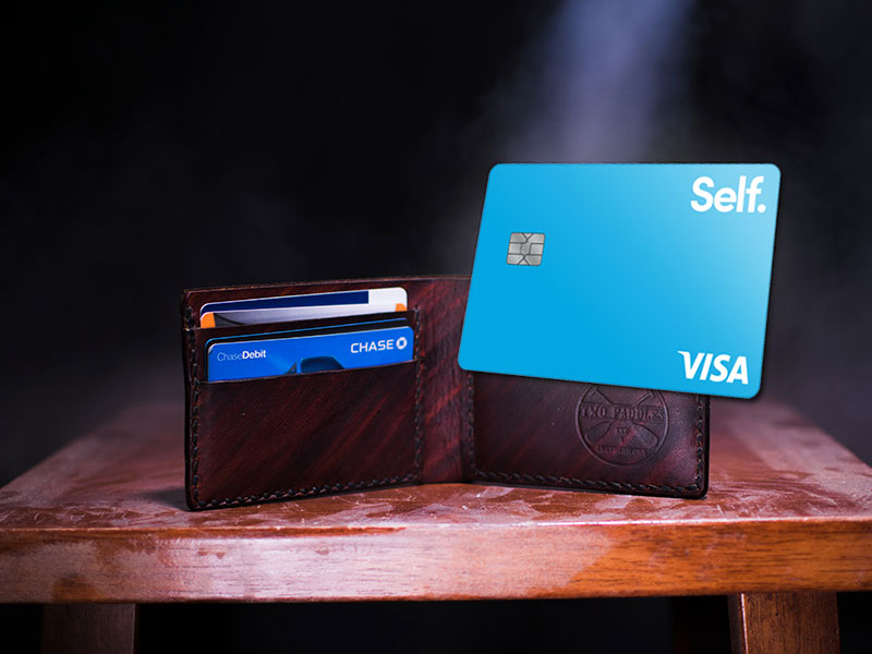 brown leather wallet on table