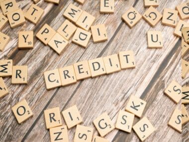 Scrabble letters spell credit