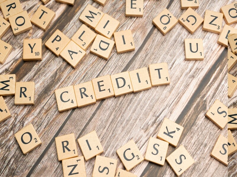 Scrabble letters spell credit